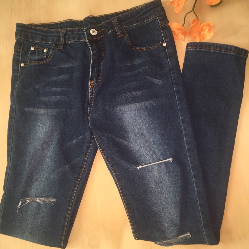 Dark washed jeans with rips